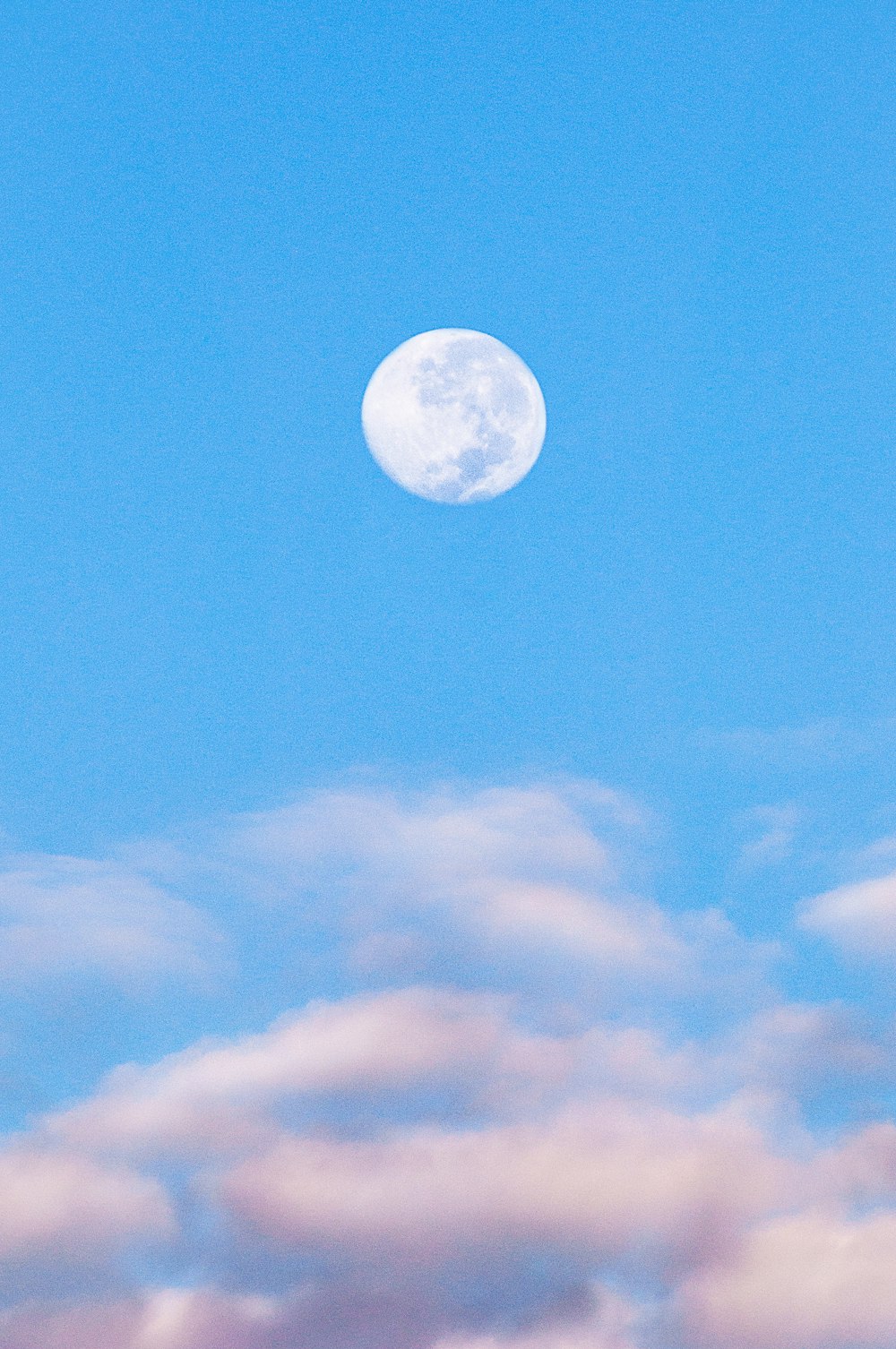 full moon in blue sky