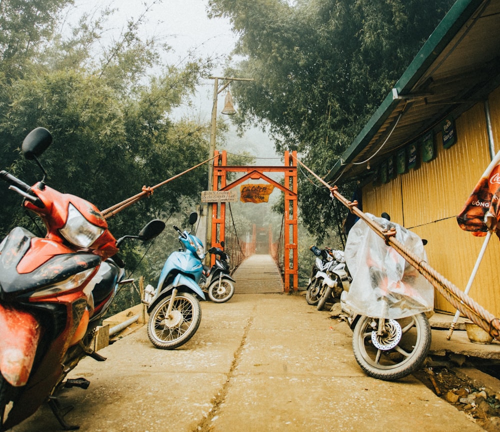 man in orange shirt riding on motorcycle