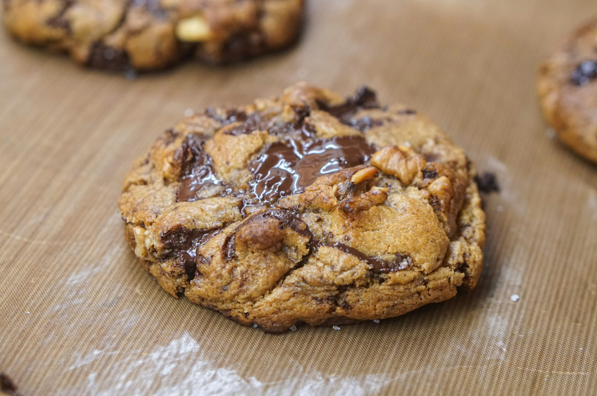 Freshly baked chocolate chip cookie with generous chocolate filling