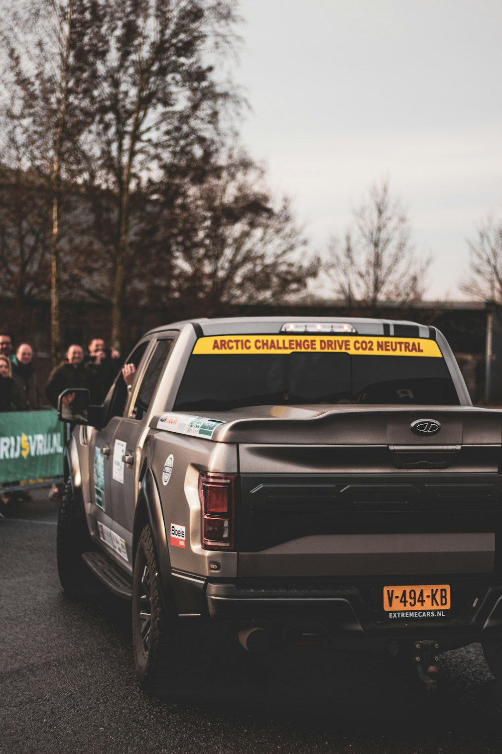 black chevrolet crew cab pickup truck on road during daytime