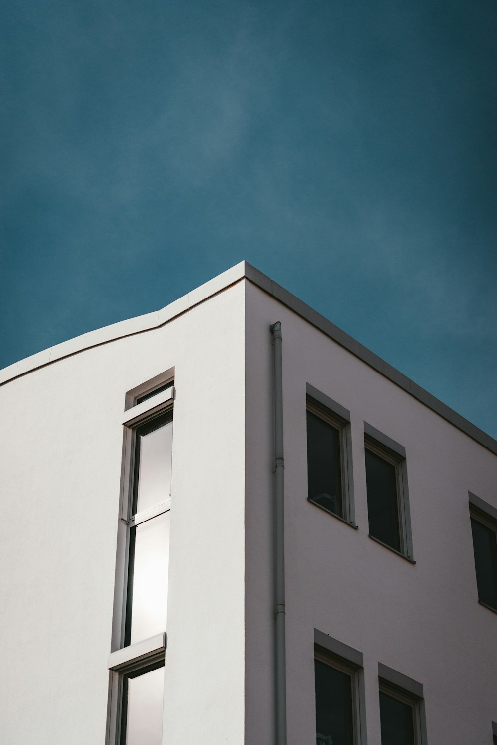 white concrete building under blue sky during daytime