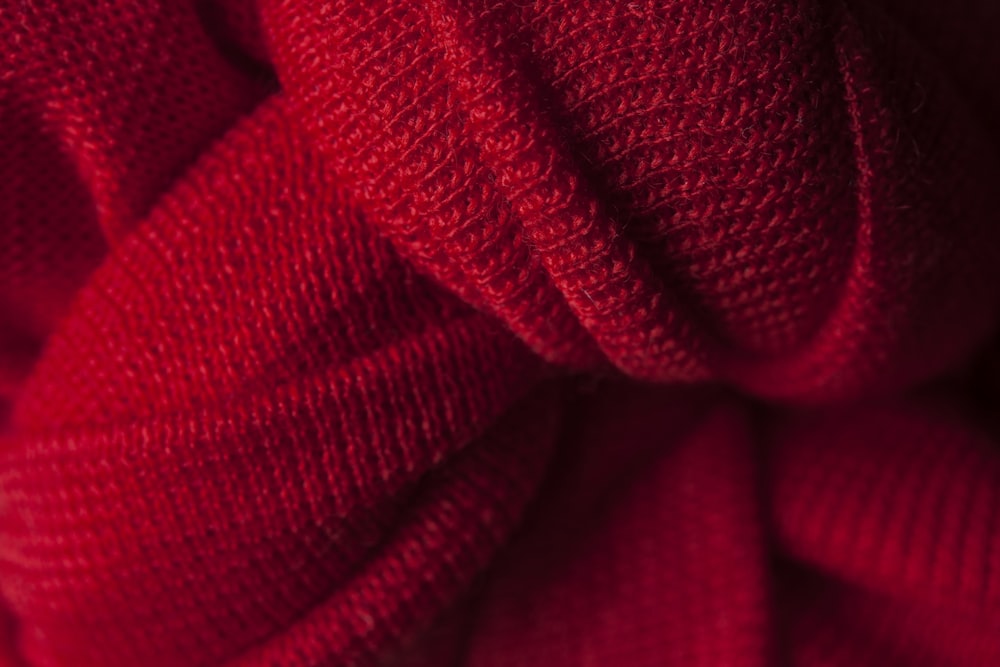 red textile in close up photography