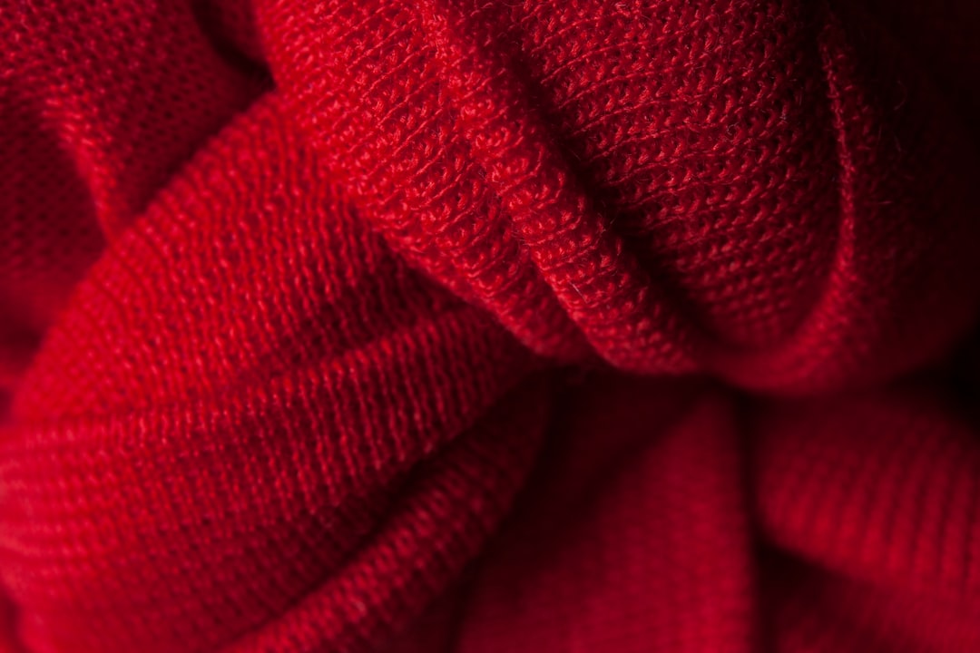 red textile in close up photography