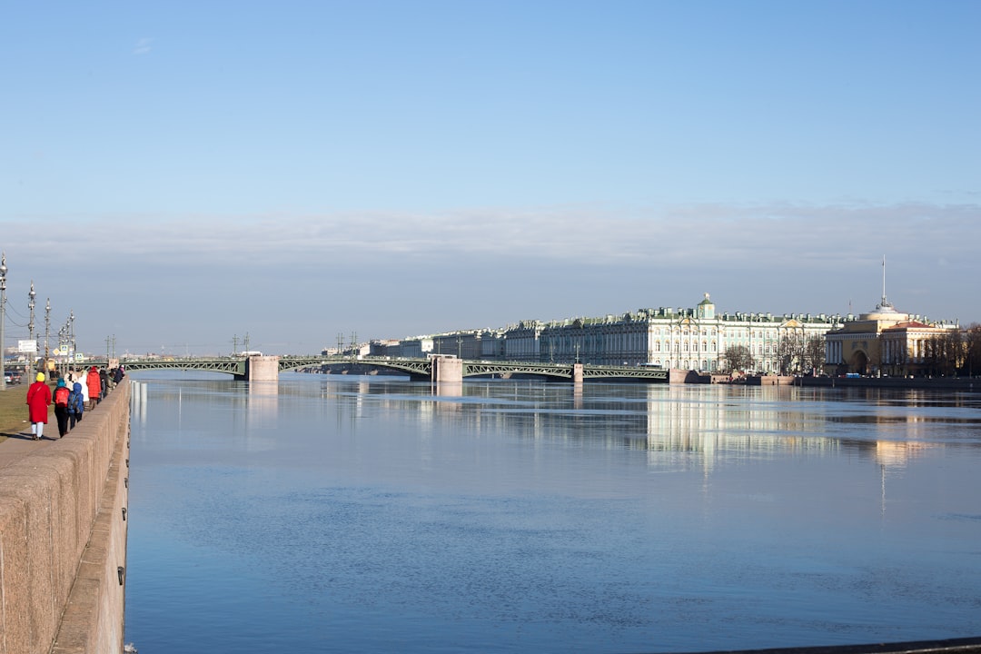 body of water near city buildings during daytime