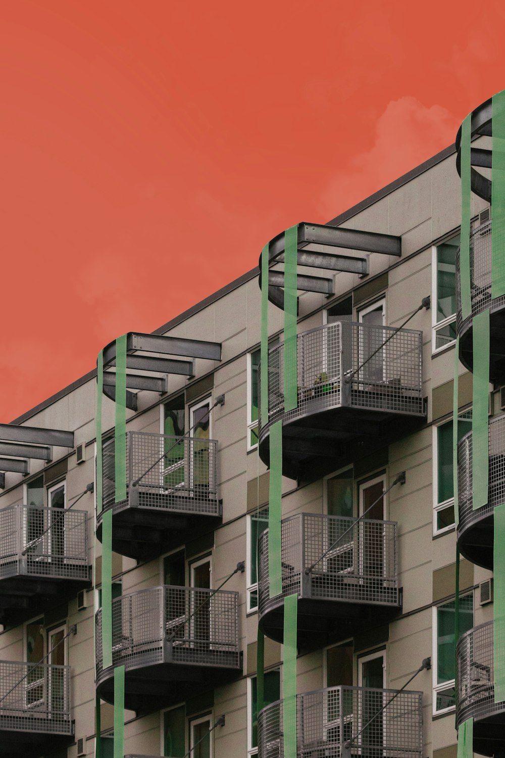 white and green concrete building under blue sky during daytime