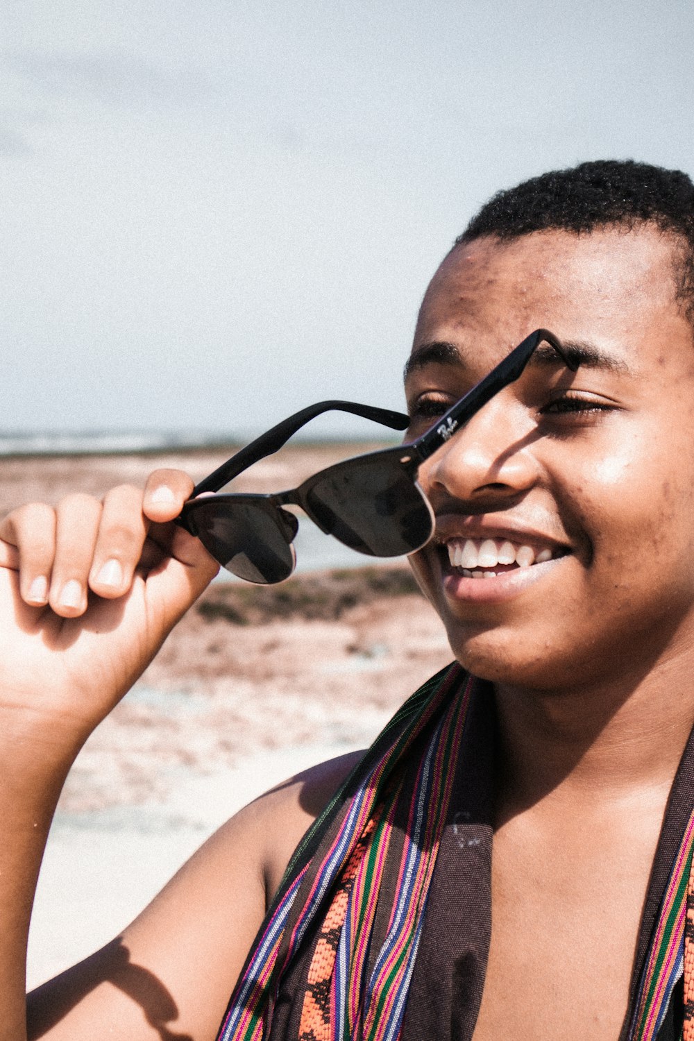 smiling woman in black sunglasses