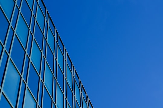 blue glass walled high rise building in Munich Germany