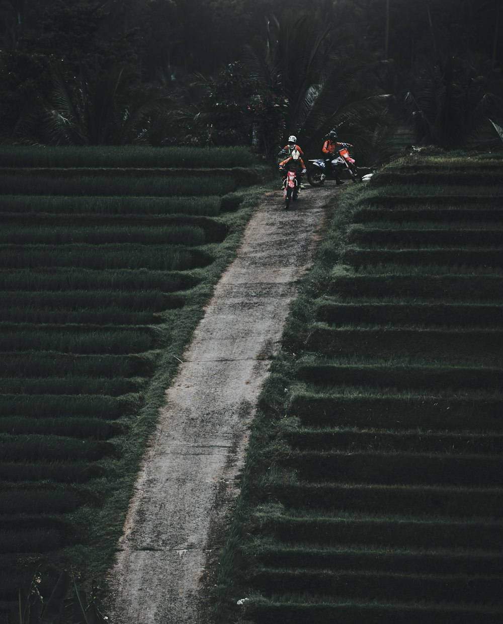 people riding motorcycle on gray concrete stairs