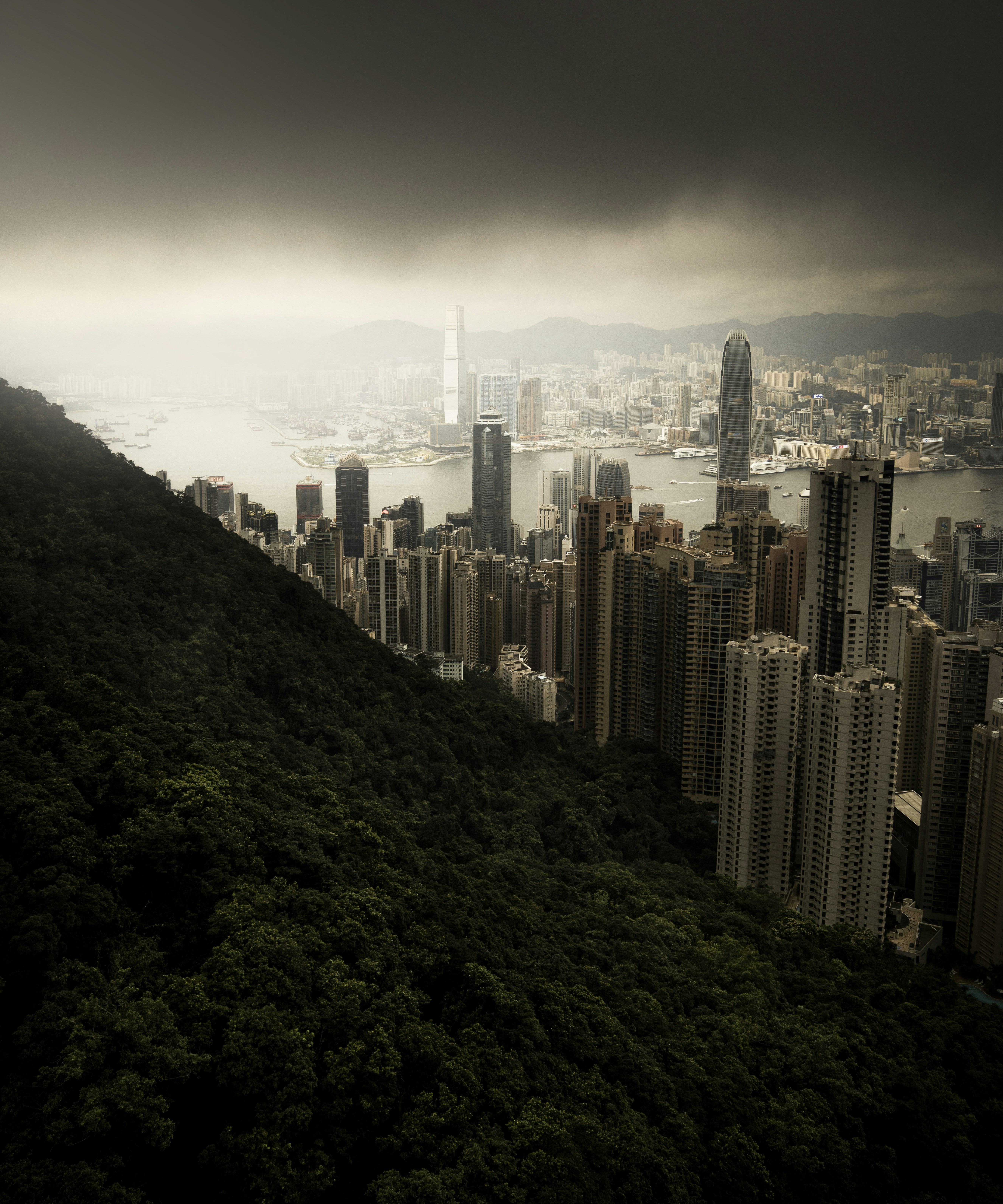 city skyline under white clouds during daytime
