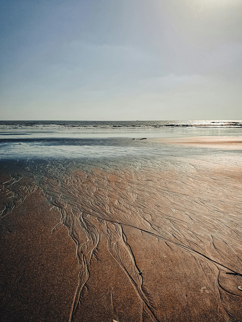 body of water under blue sky during daytime