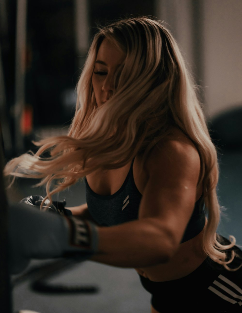 woman in black sports bra and black pants