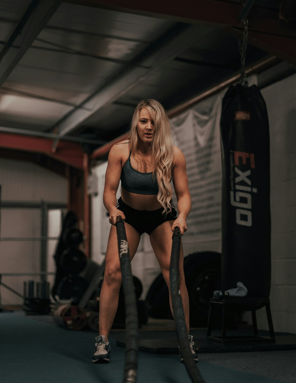 woman in black sports bra and black shorts