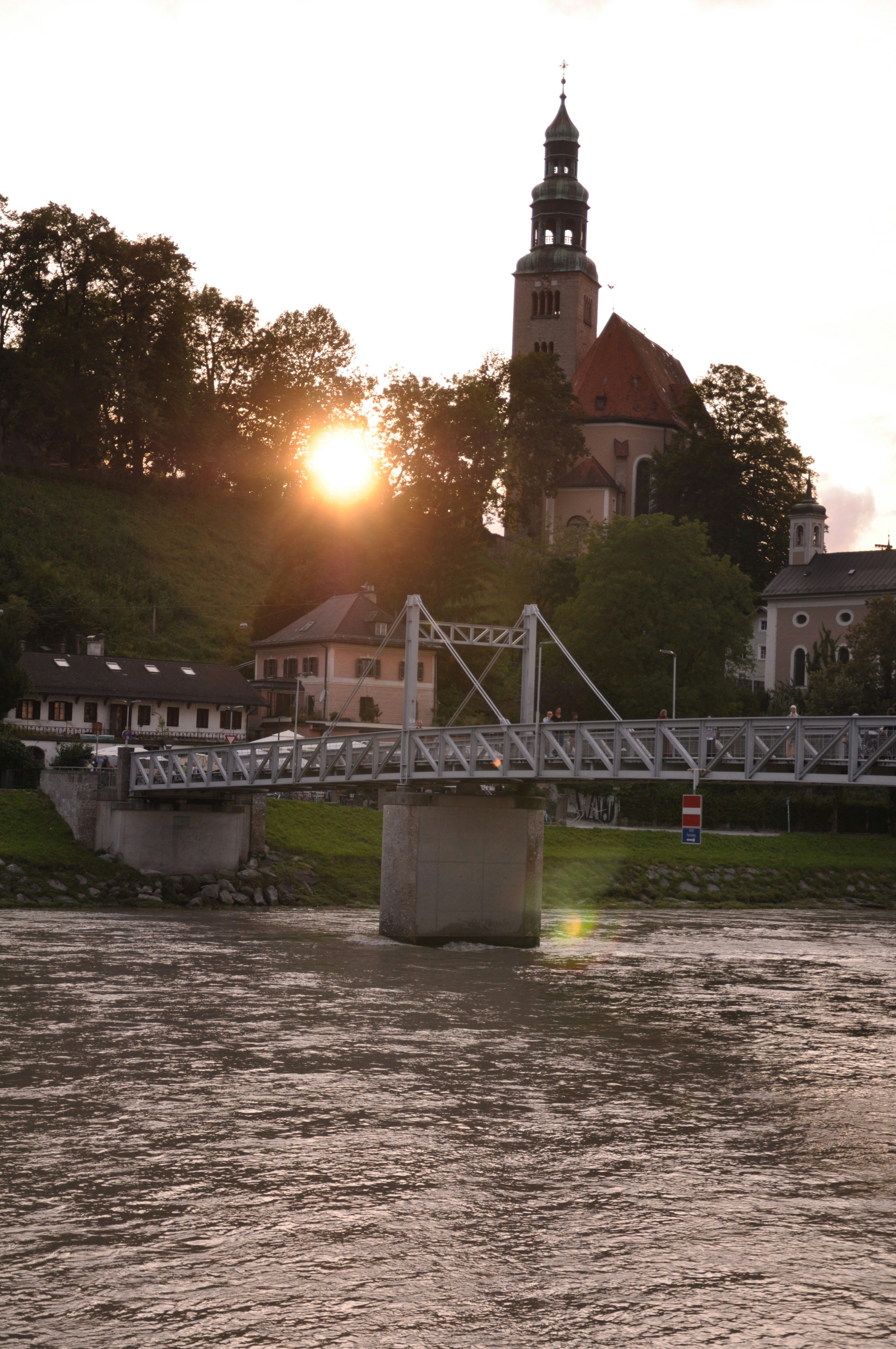 brown concrete building near bridge during daytime