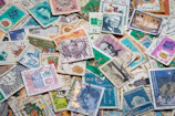 An elegant vintage stamp collection arranged by country on a vibrant display.