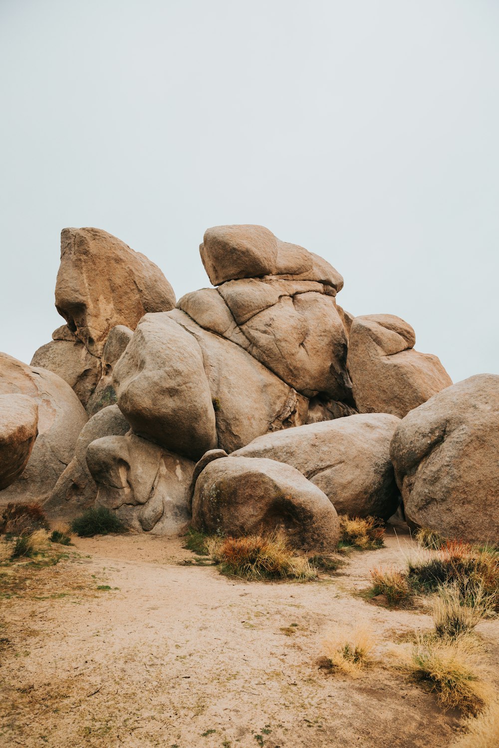 brown rock formation on brown field