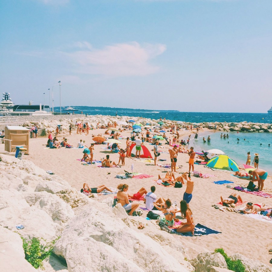 Parasols and towels across a wide sandy beach
