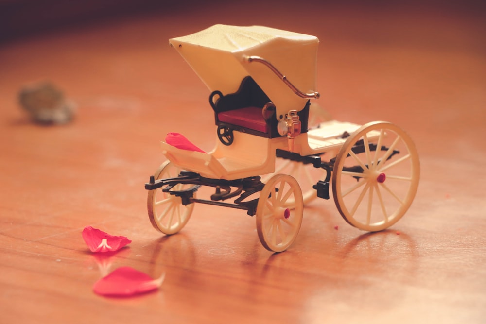 yellow and black trike with pink flower petals