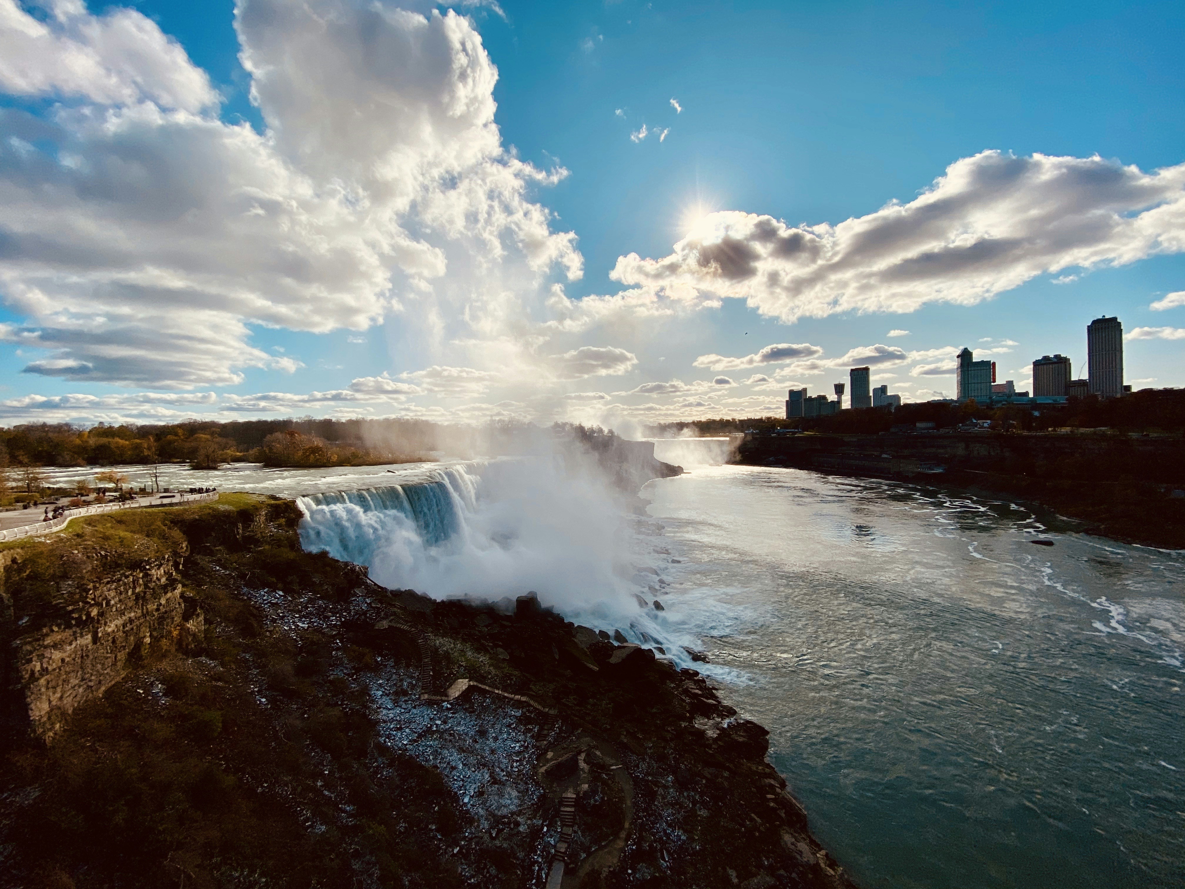 water falls under blue sky and white clouds during daytime, Niagara Falls USA View