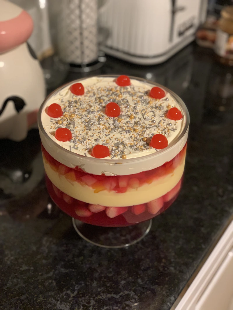 Layered Latvian rye bread dessert with whipped cream and berries