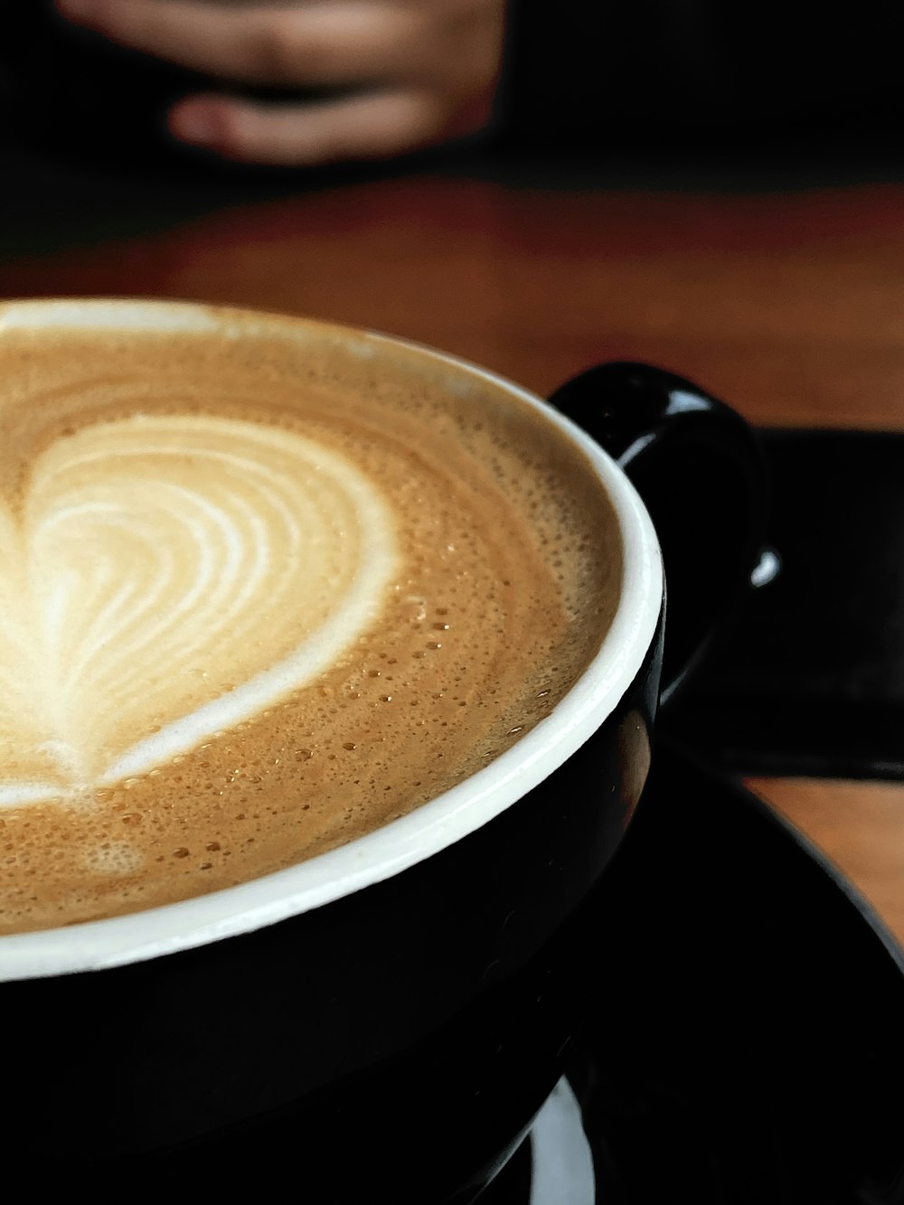 black and white ceramic mug with coffee