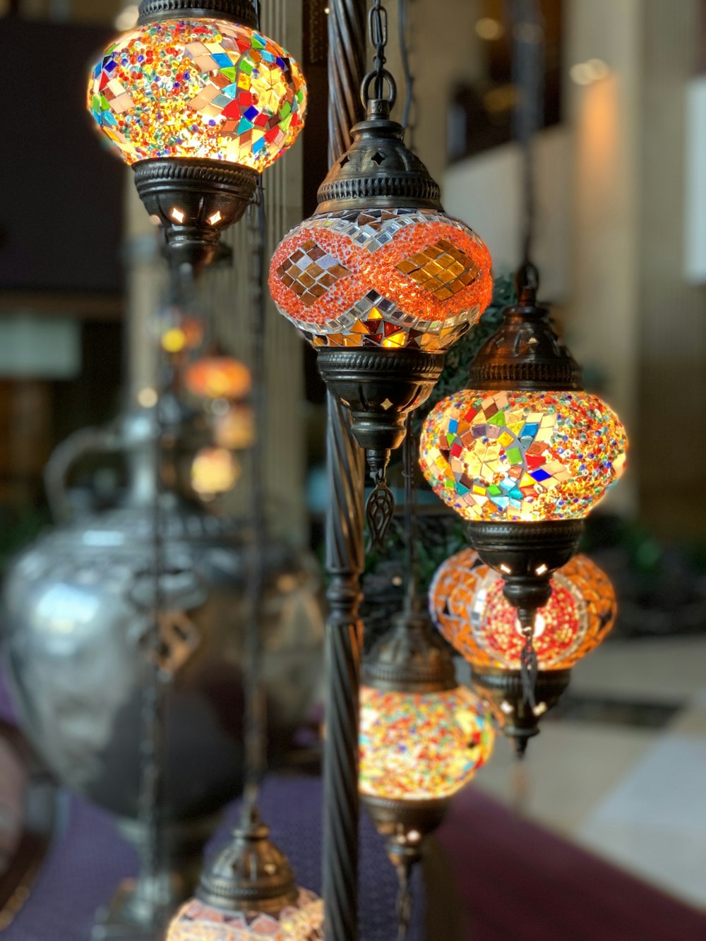 selective focus photography of gold and red floral pendant lamp