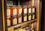 brown glass jars on brown wooden shelf