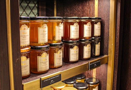 brown glass jars on brown wooden shelf