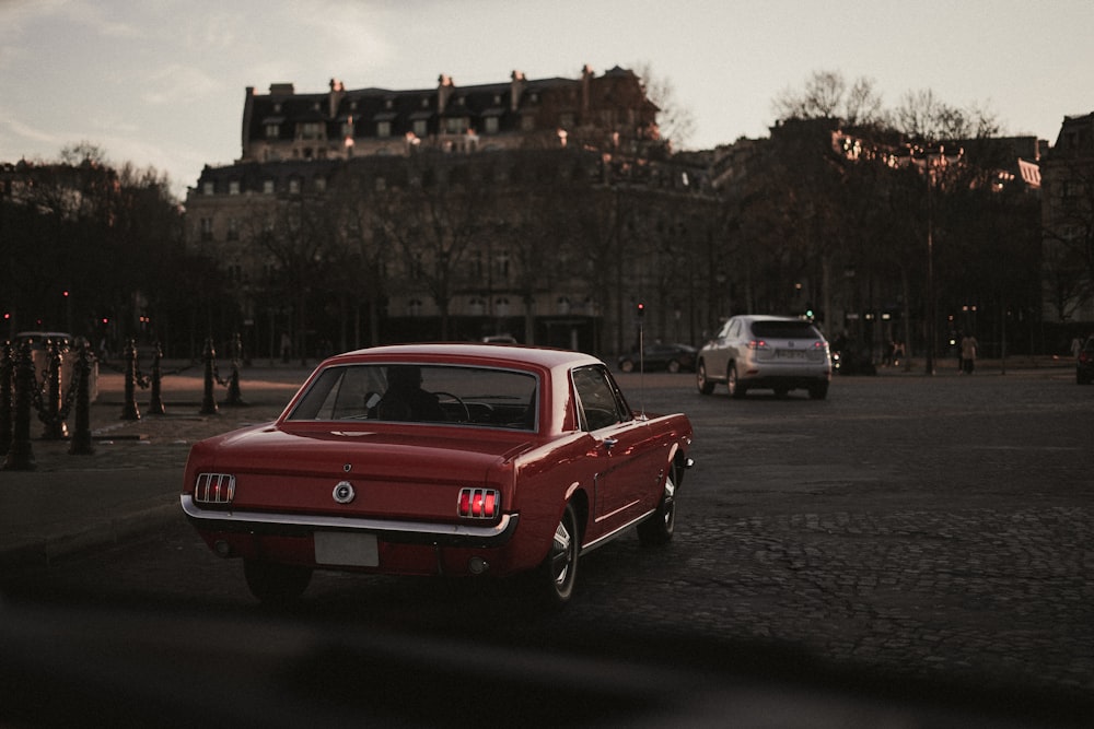 red sedan on road during daytime