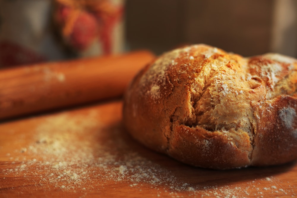 a loaf of bread sitting on top of a wooden table