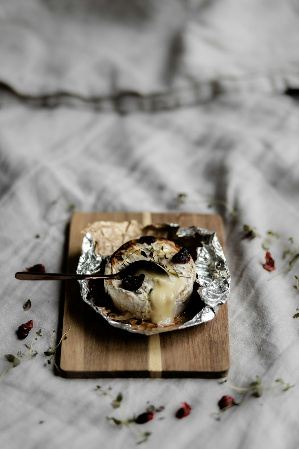 brown and white cake on brown wooden tray