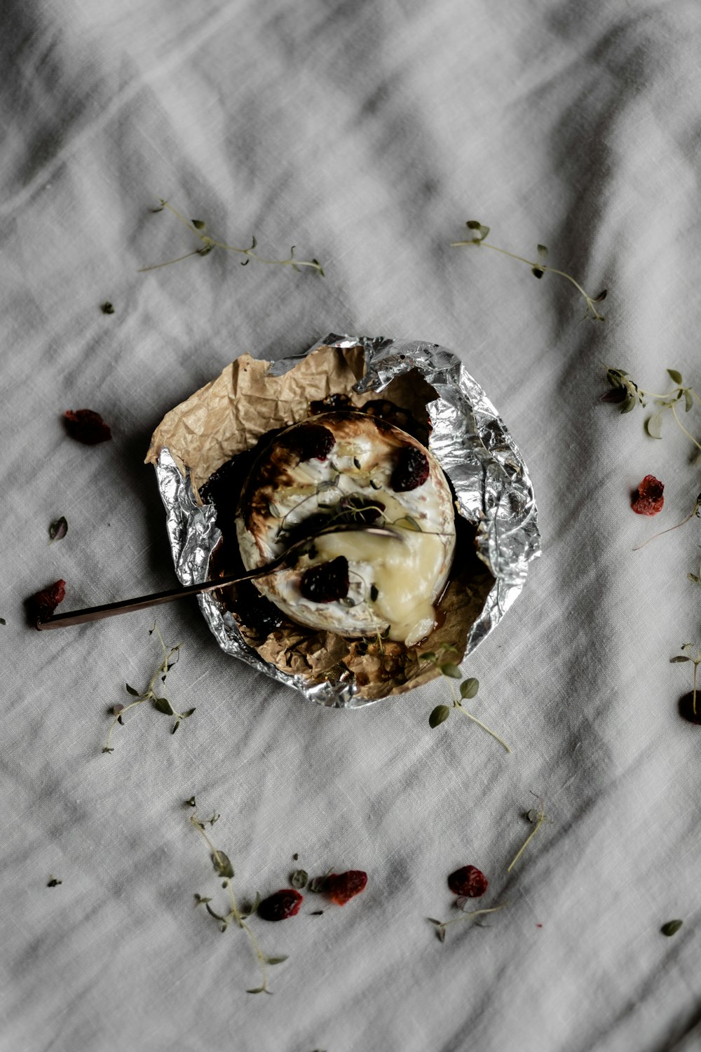 brown and white pastry on white textile