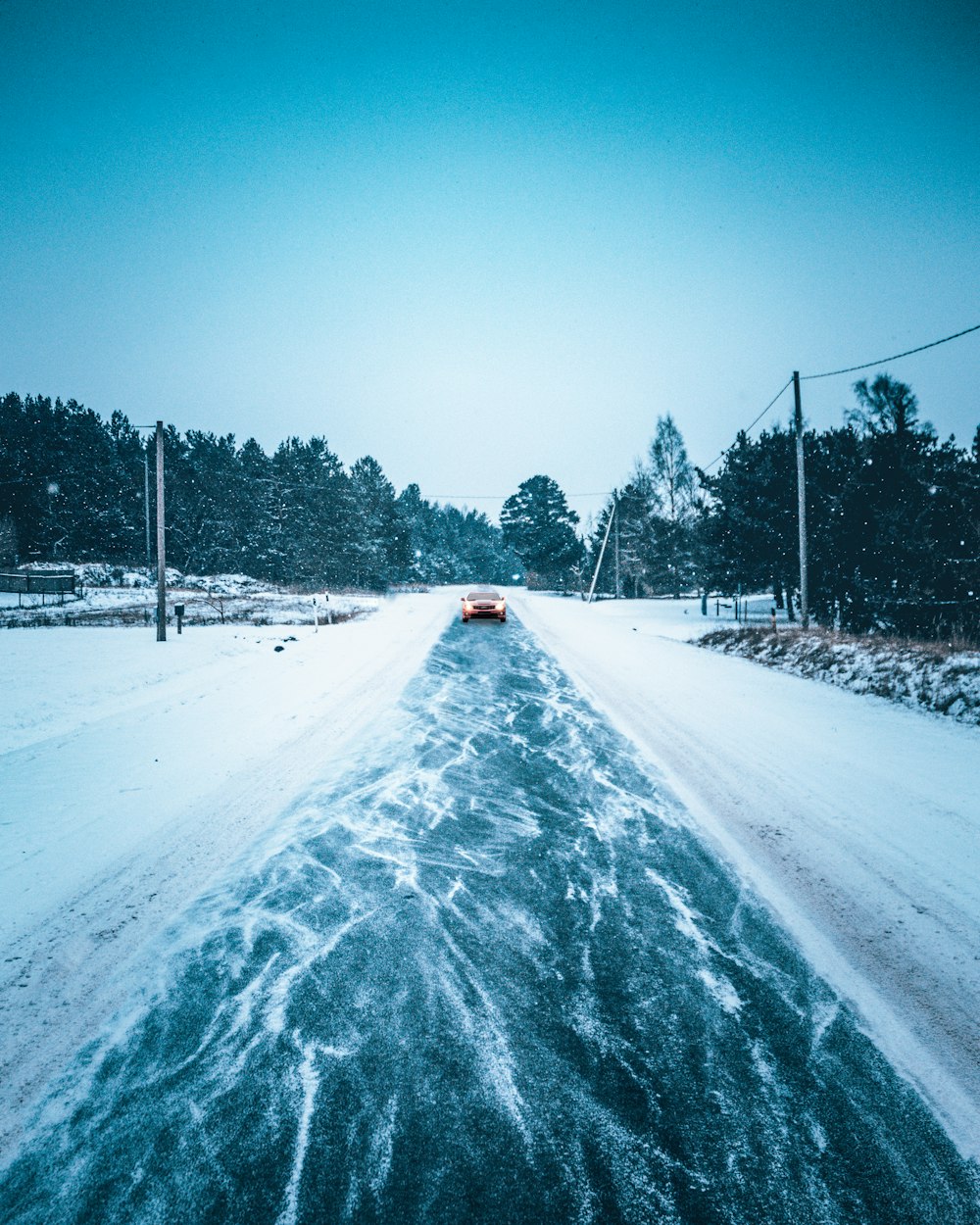 snow covered road during daytime