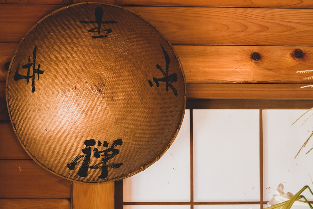 brown round decor on white wooden wall