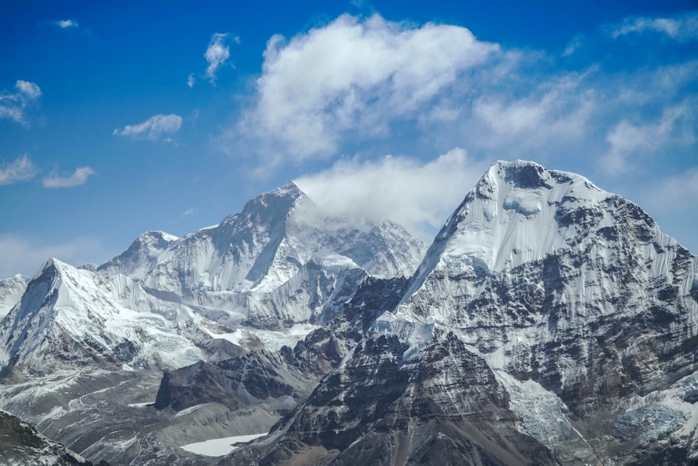 snow covered mountain under blue sky during daytime