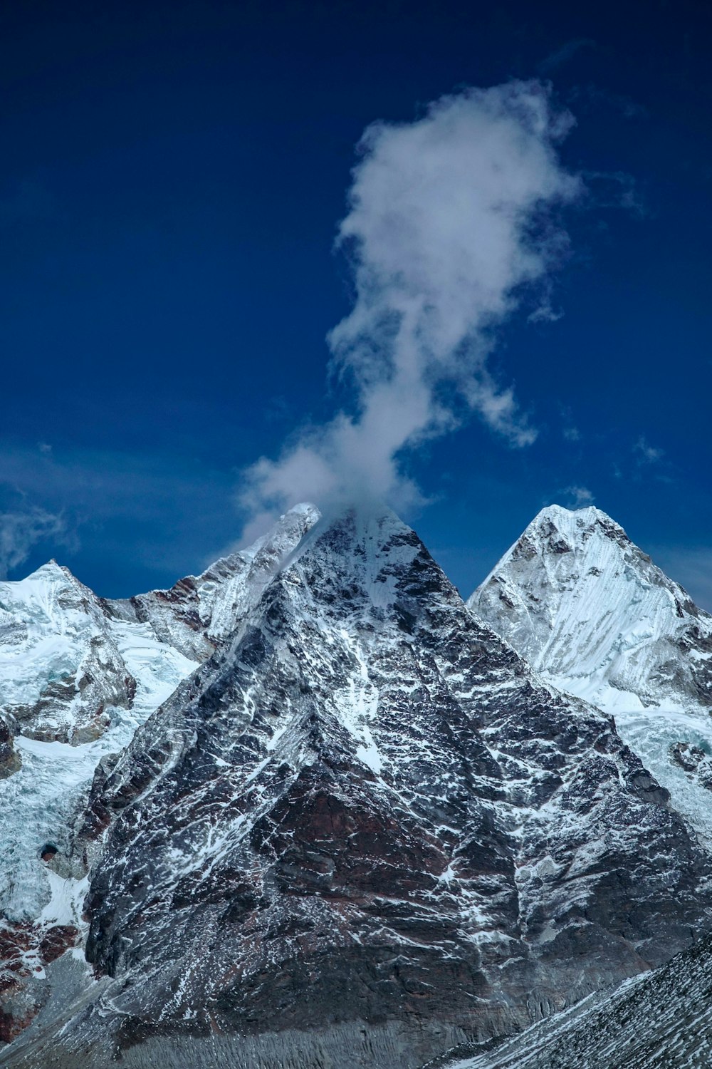 snow covered mountain under blue sky during daytime