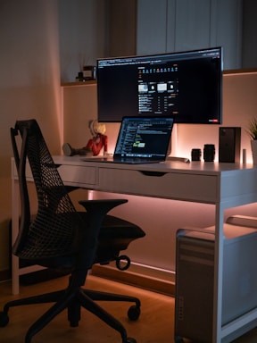 Modern office workspace with a sleek computer and golden accents reflecting the dc nexus brand style.
