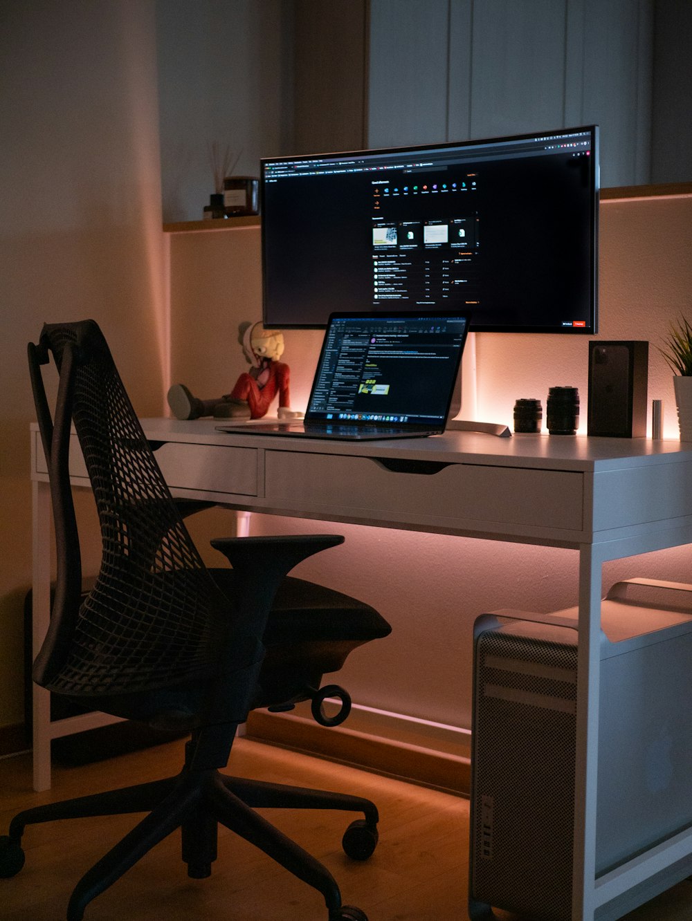 black laptop computer on white wooden desk