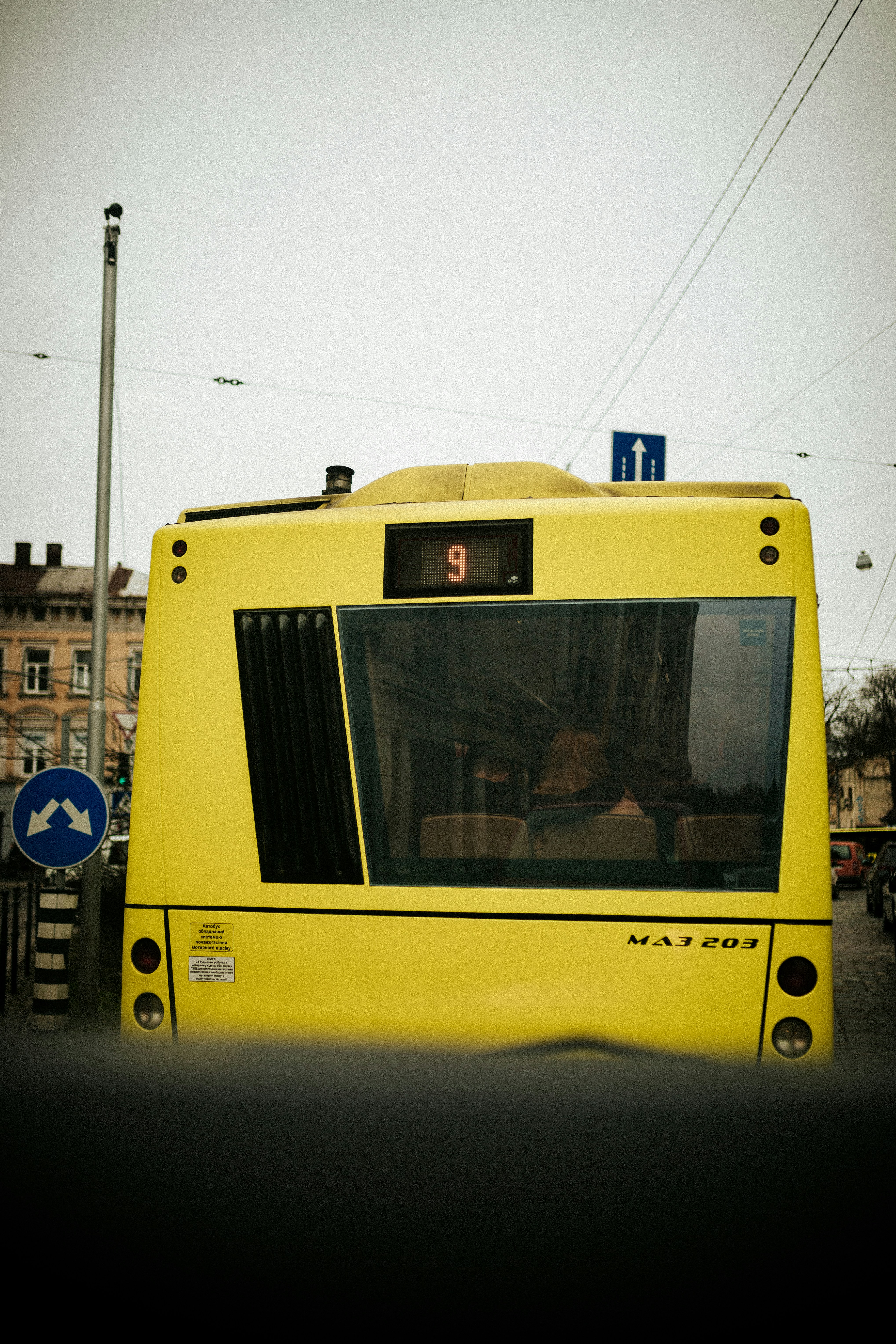 yellow and white bus on road during daytime