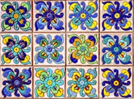 A collection of decorative ceramic tiles in various colors.
