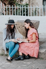 A serene outdoor setting with women reading together.