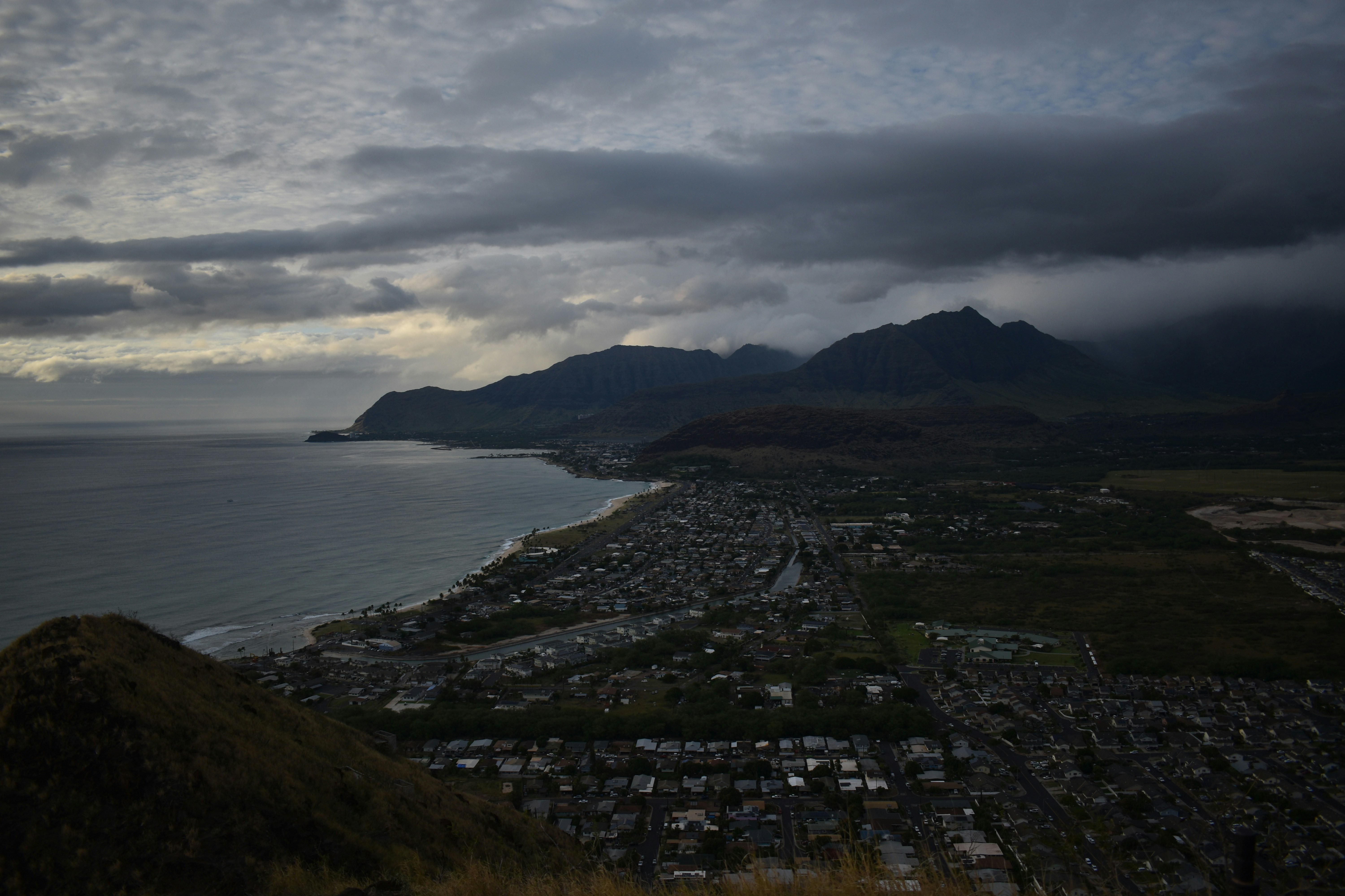 aerial view of city near body of water during daytime