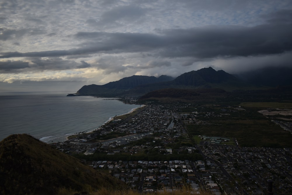 aerial view of city near body of water during daytime