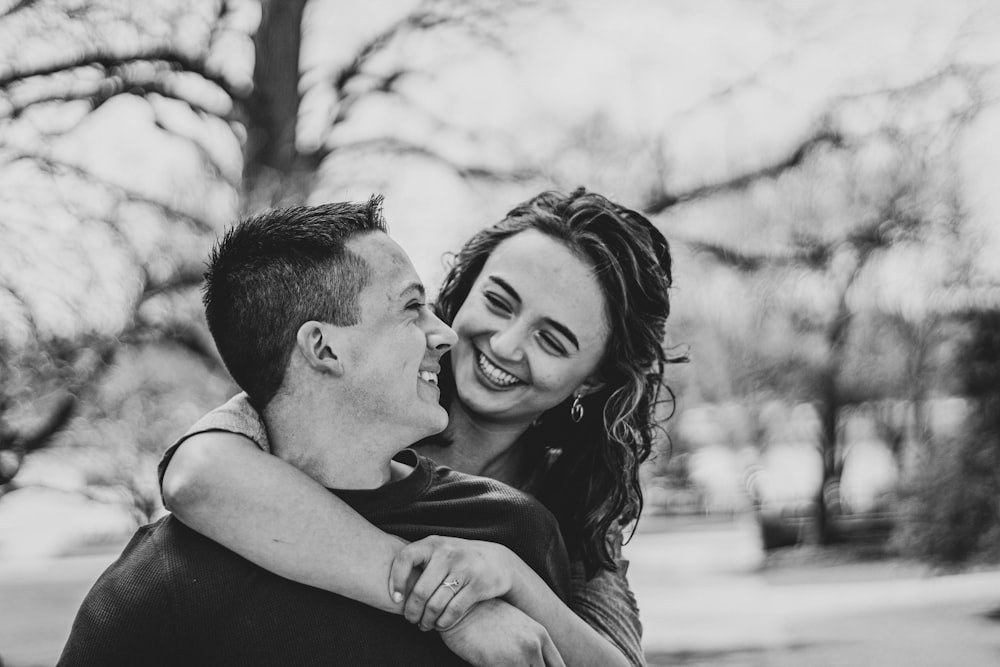 man kissing womans forehead