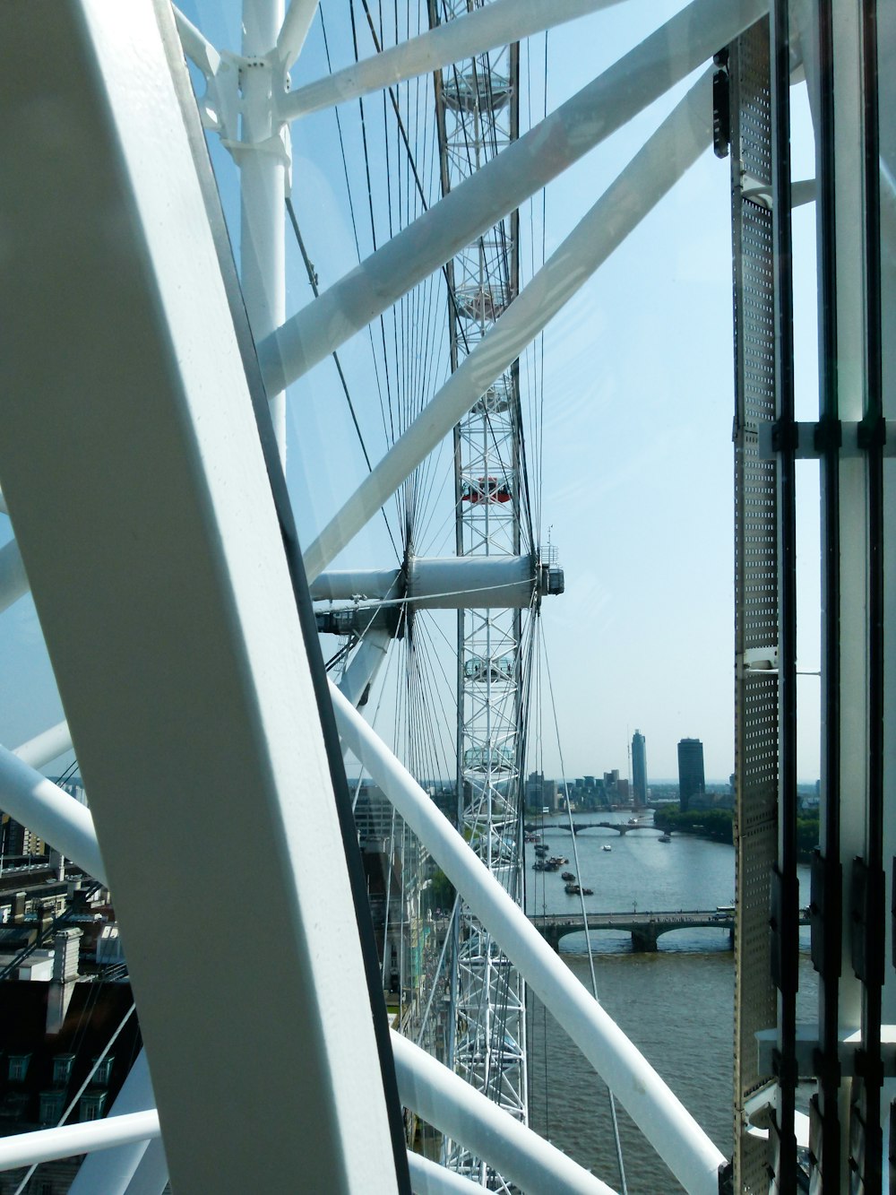 white metal bridge over river during daytime