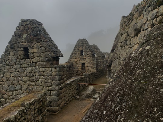 brown brick building under white sky during daytime in Mountain Machu Picchu Peru