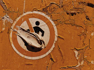 Detail of a safety sign mounted on a wall with polished epoxy coating