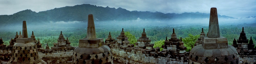 brown concrete temple near mountain during daytime