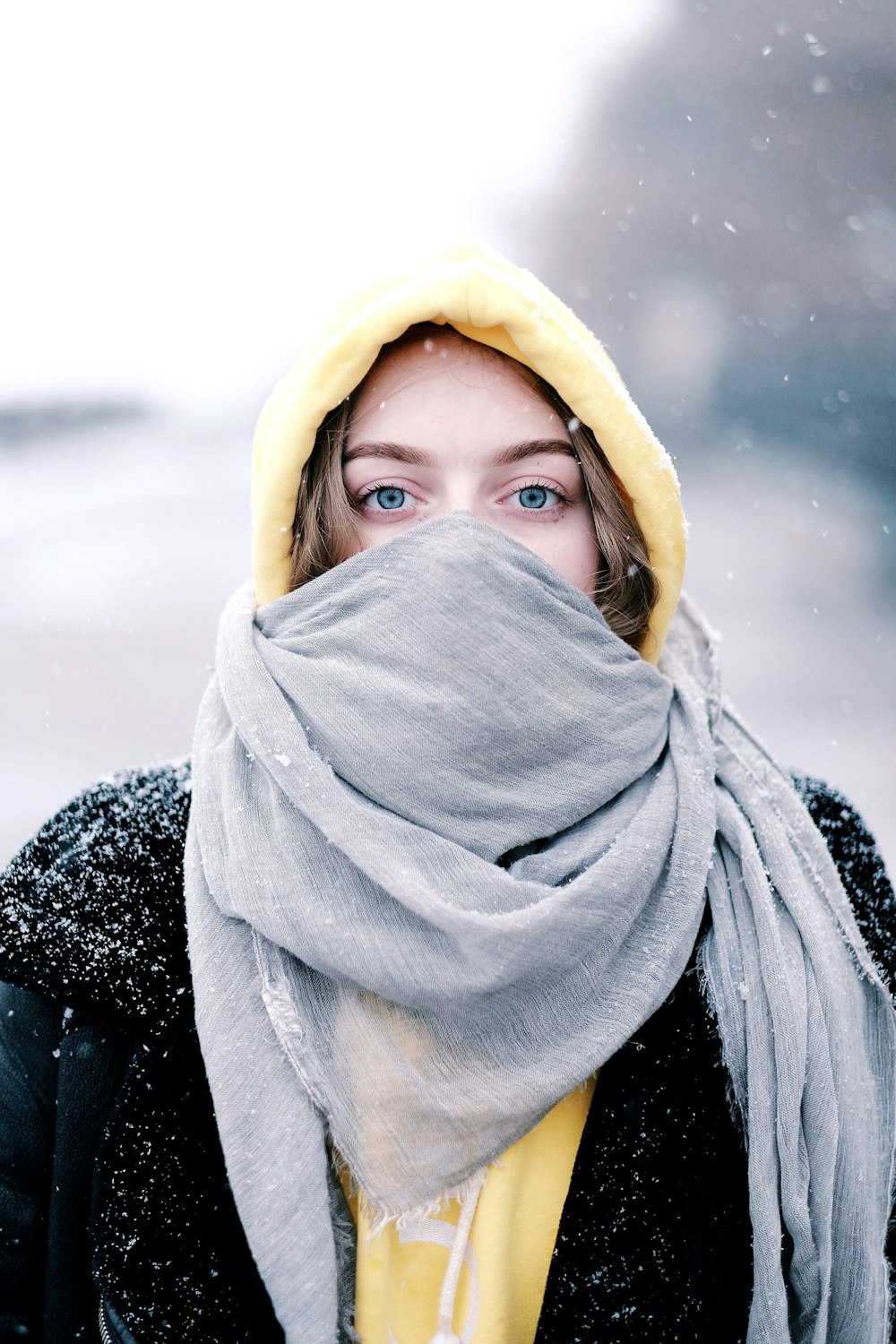 woman in gray hijab and black and white coat