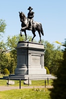 man riding horse statue during daytime