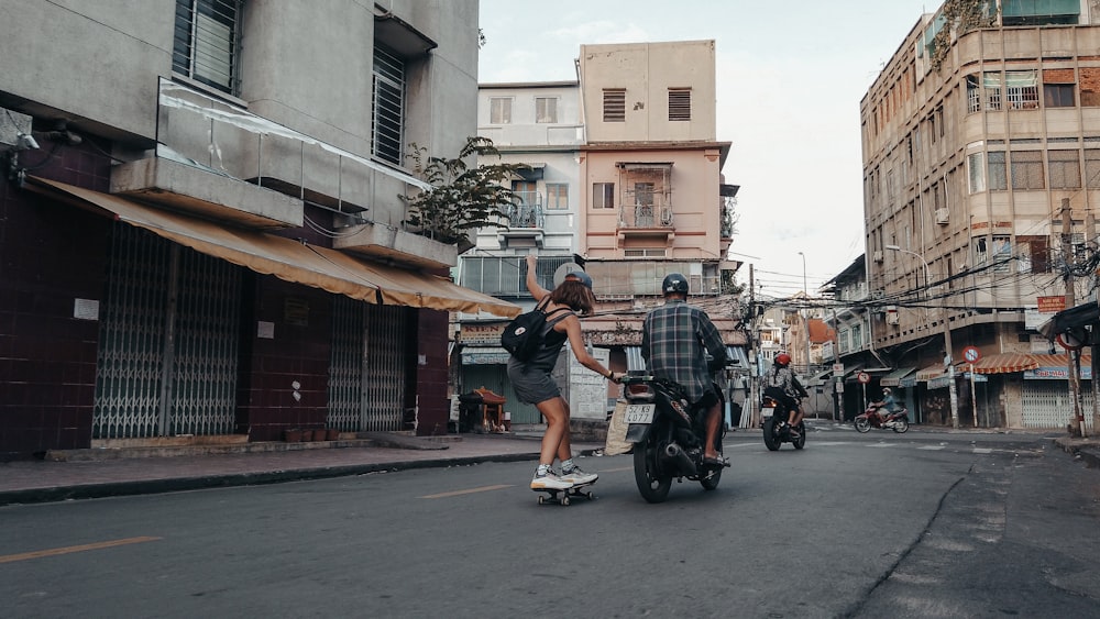 man in black t-shirt riding on black motorcycle during daytime